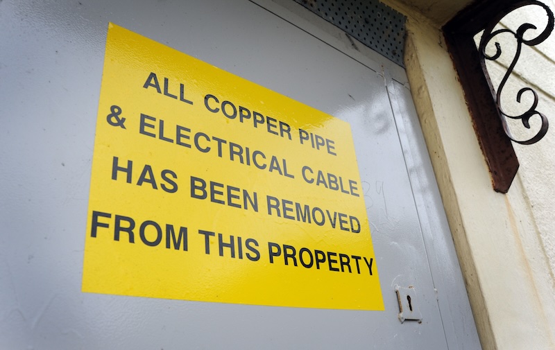 Wire theft warning sign.