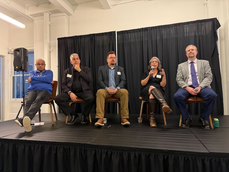 5 People on panel discussion.